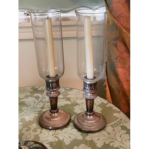 Appraisal: Pair of candlestick storm lights with silver plated weighted bases