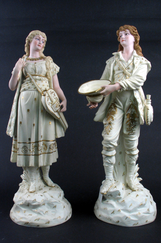 Appraisal: PAIR GERMAN RUDOLSTADT BISQUE PORCELAIN FIGURES young woman with stringed