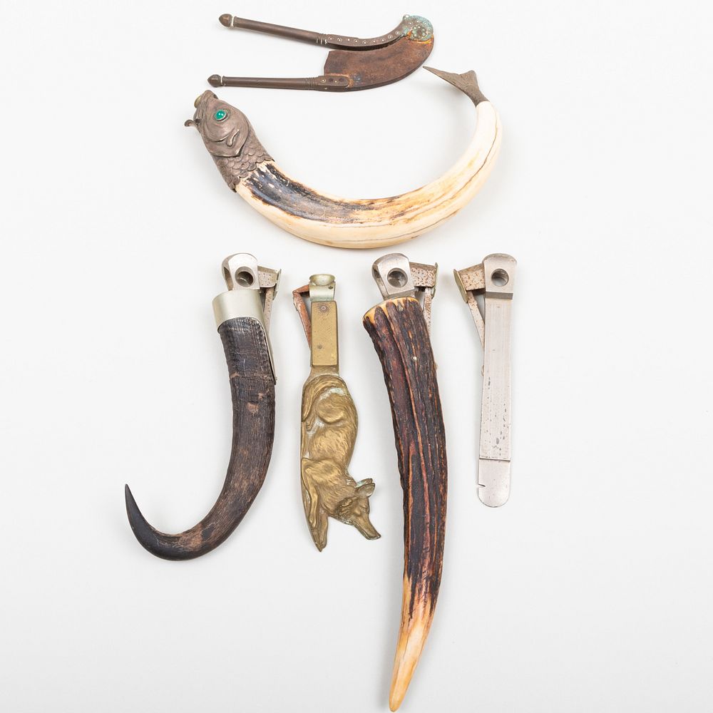 Appraisal: Group of Six Cigar Cutters Comprising A fish mounted boar