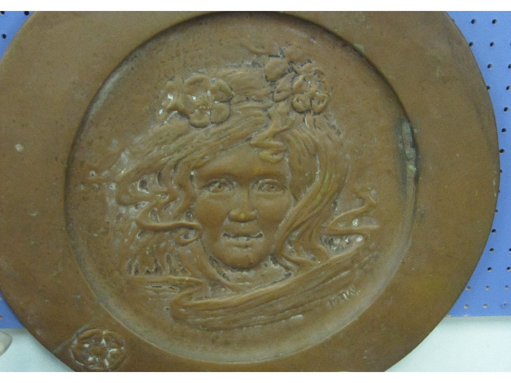 Appraisal: Art Nouveau wall charger depicting a maidens head initialled MTW