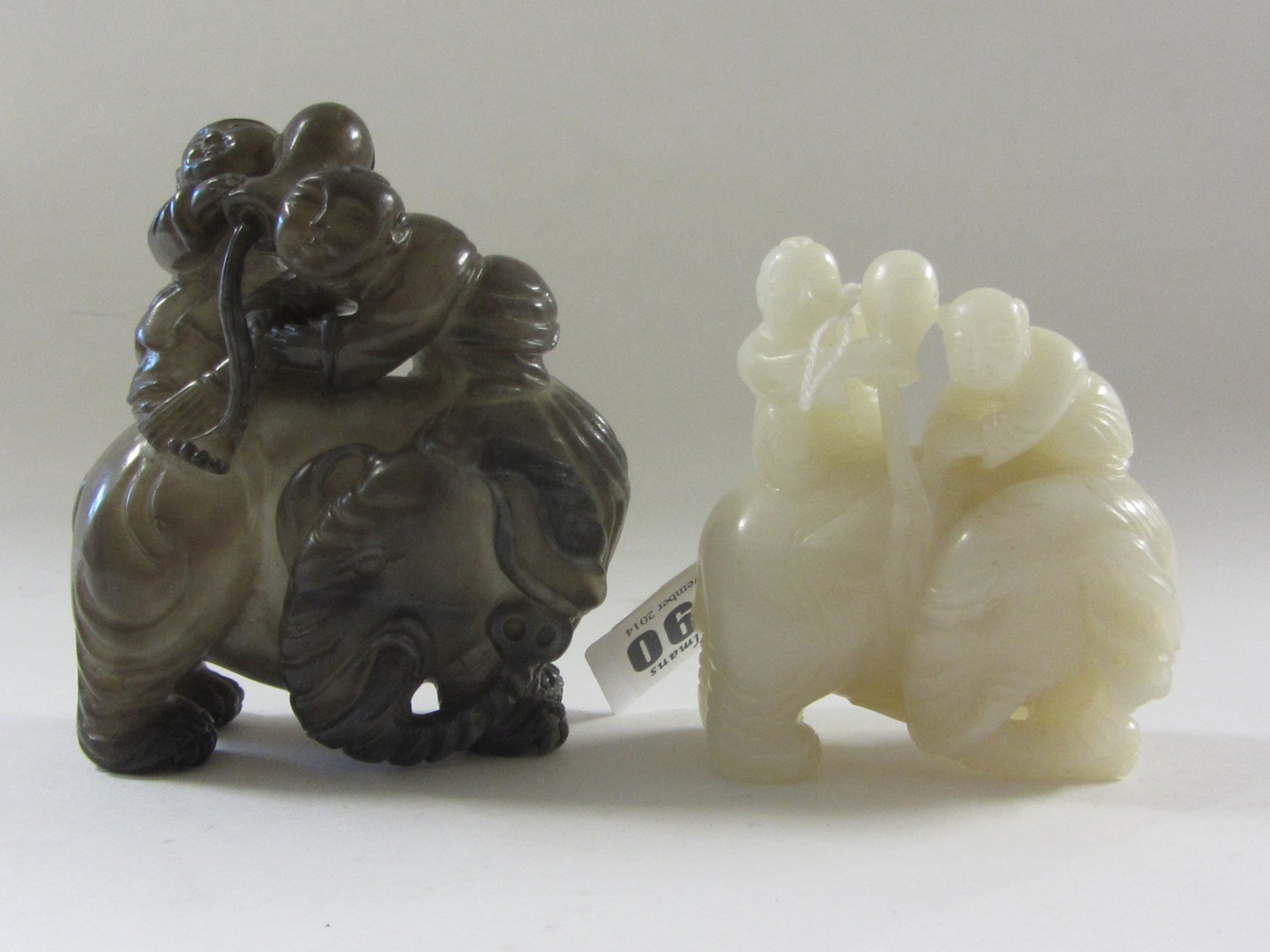 Appraisal: A Chinese white jade group th century carved as two