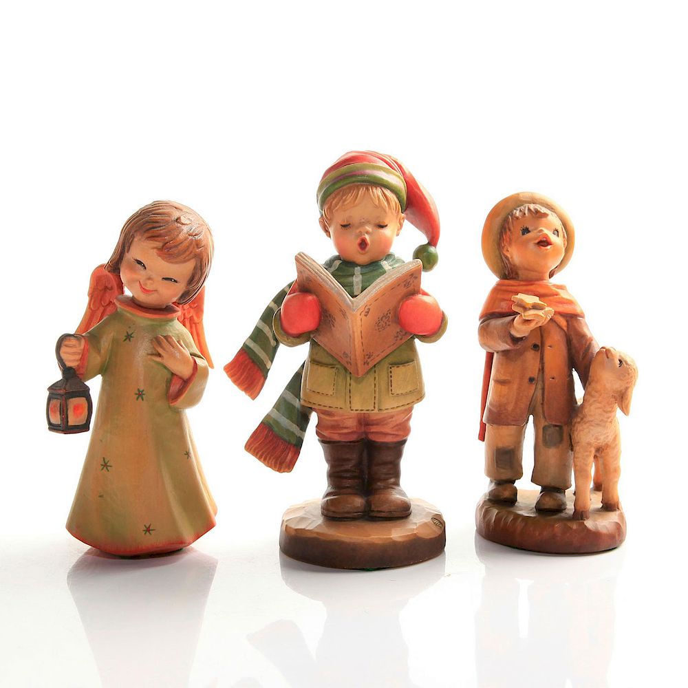 Appraisal: ANRI WOODCARVING FIGURINES Beautiful handmade child and angel figurines STAR