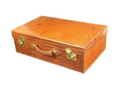 Appraisal: A crocodile suitcase with brass locks stamped 'British' and with