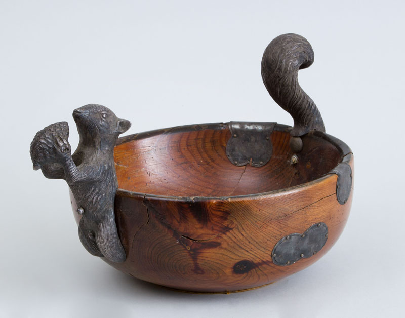 Appraisal: PEWTER-MOUNTED TURNED ELMWOOD BOWL The handles modeled as a squirrel