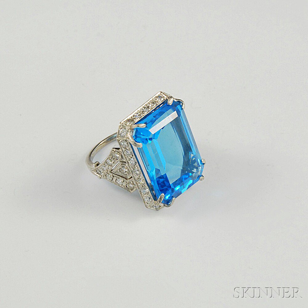 Appraisal: Platinum Blue Topaz and Diamond Cocktail Ring the large emerald-cut