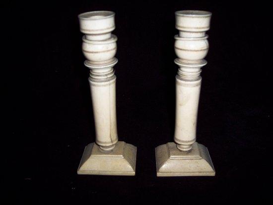 Appraisal: A pair of th Century ivory candlesticks with turned columns