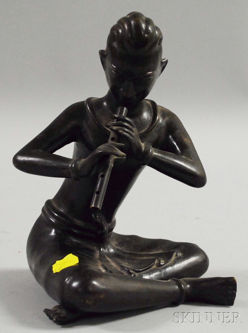 Appraisal: Asian Patinated Bronze Figure of a Seated Flute Player ht