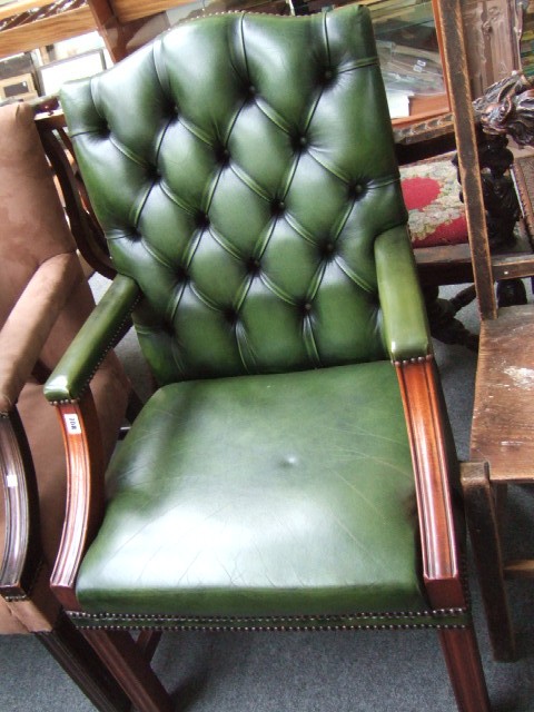 Appraisal: A Gainsborough style mahogany framed open armchair with studded green