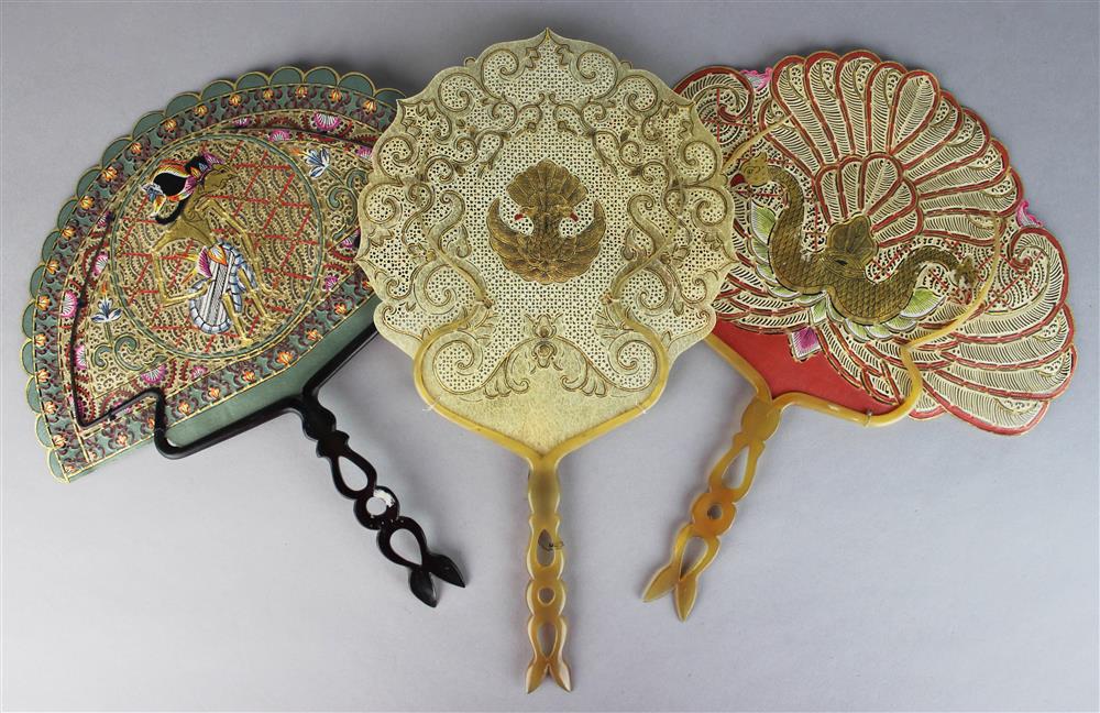 Appraisal: THREE BALINESE FANS each of delicately pierced parchment and mounted