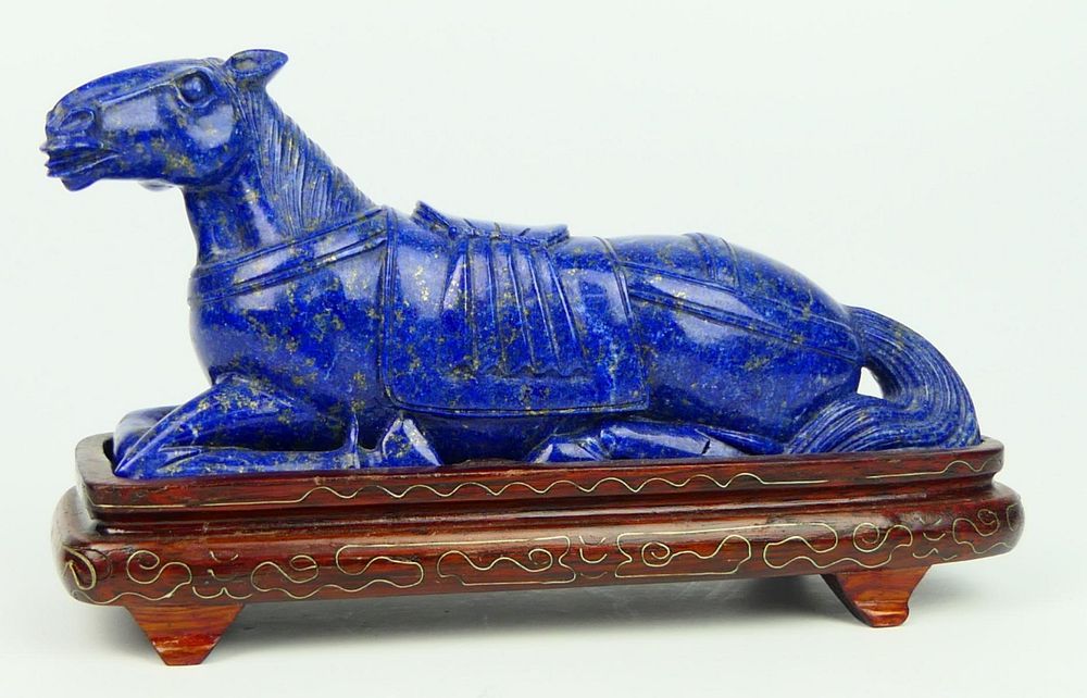 Appraisal: CHINESE LARGE LAPIS LAZULLI RECOMBENT HORSE Measures long cm and