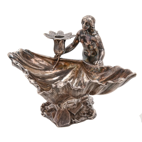 Appraisal: A Victorian cast silver figural mermaid-and-shell taperstick with flower shaped