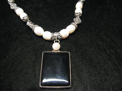 Appraisal: Pearl and onyx necklace Baroque pearl necklace with unusual sterling