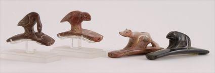 Appraisal: FOUR FIGURAL PLATFORM STONE PIPES Including a crane fox and