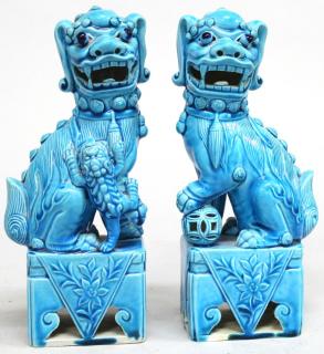 Appraisal: Pair of Turquoise The porcelain Foo Dogs in traditional poses