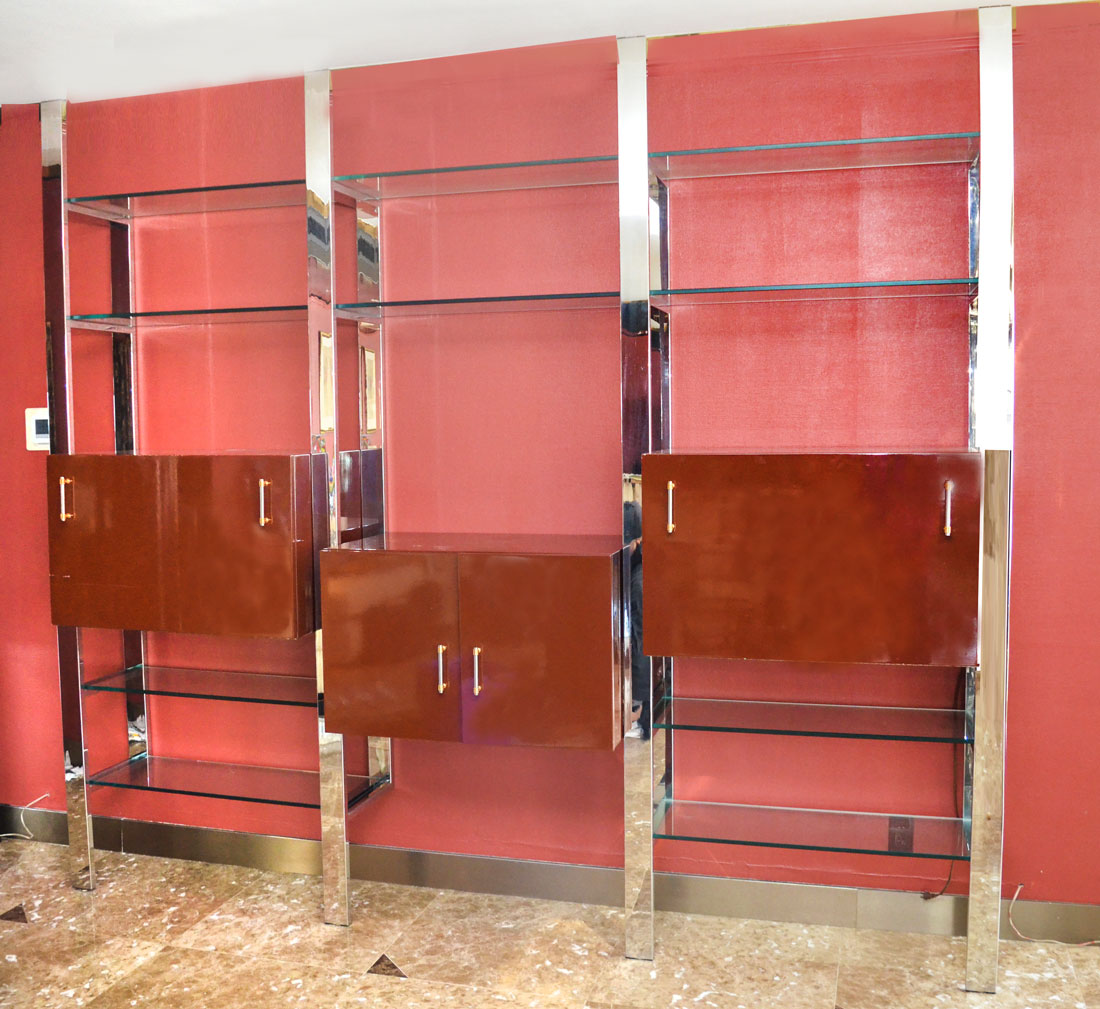 Appraisal: MODERNE CHROME AND GLASS WALL UNIT Unit constructs to floor