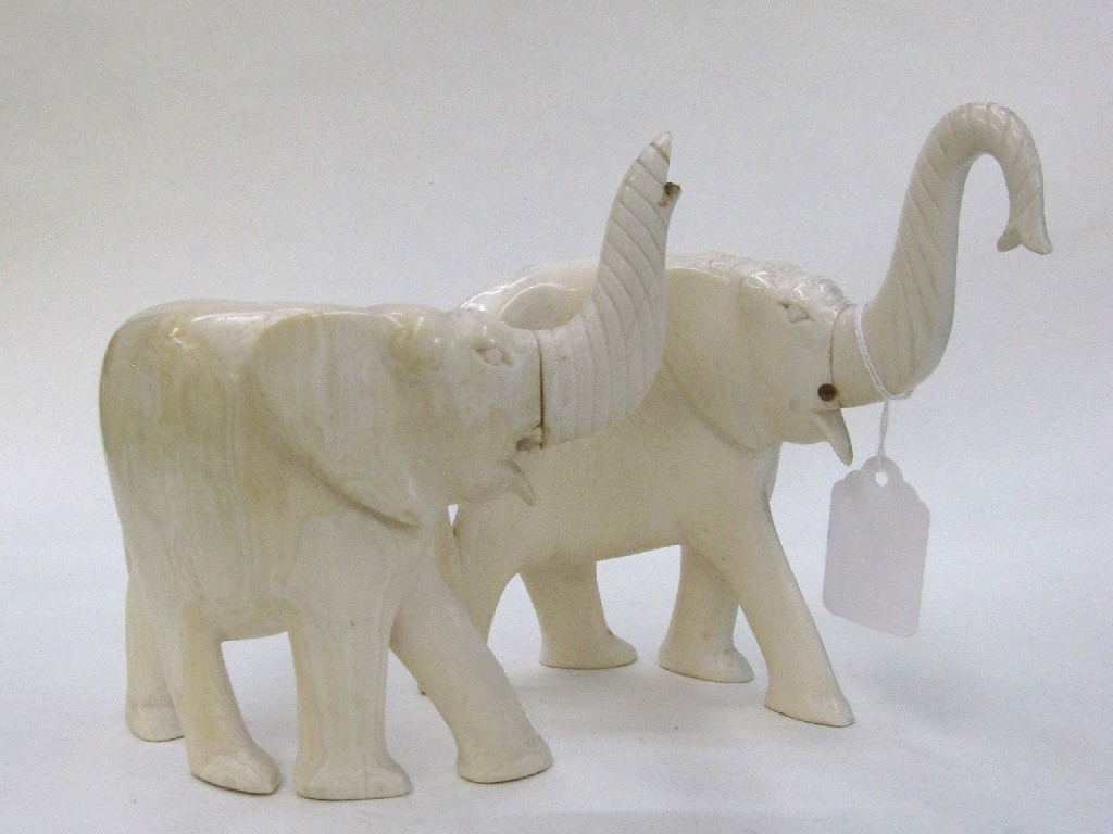 Appraisal: Pair of carved ivory elephant figures one def