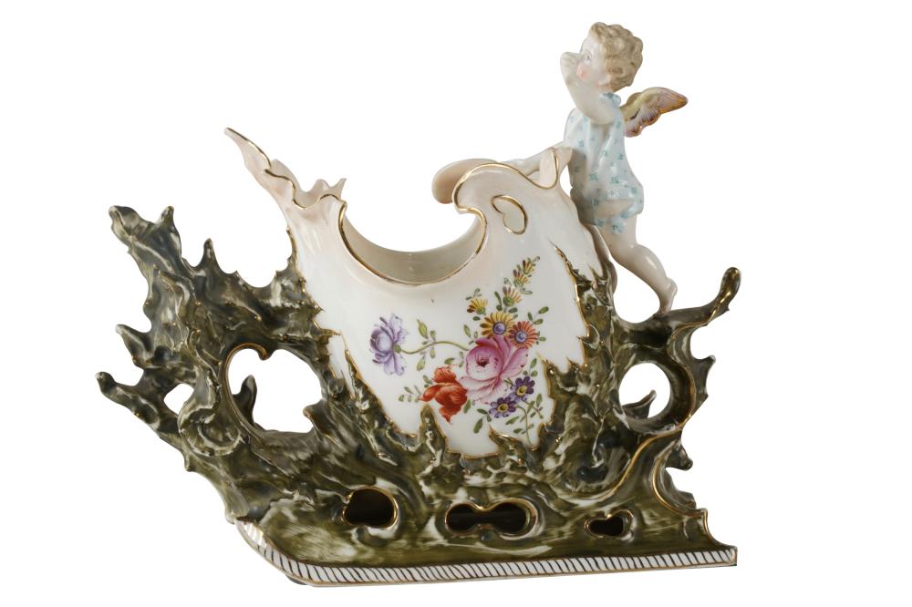 Appraisal: ROCOCO-STYLE PORCELAIN SHELLhand-painted number in puce to underside and no