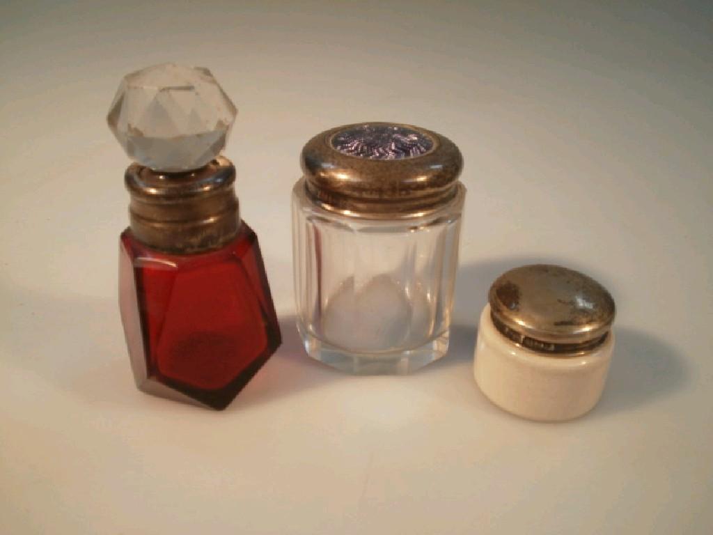 Appraisal: A Victorian ruby glass scent bottle with silver neck silver