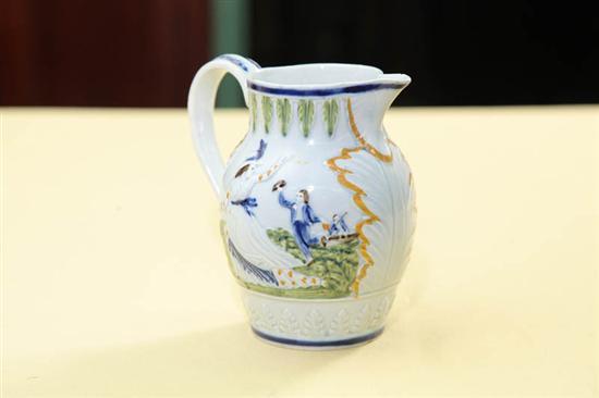 Appraisal: PRATTWARE CREAMER Embossed scenes with courting couples and acanthus leaf