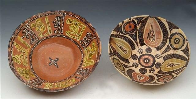 Appraisal: TWO EARLY PERSIAN POTTERY BOWLS decorated in polychrome enamels peacock