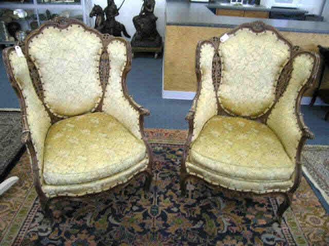 Appraisal: Pair of French Style Wing Back Chairs fine carved trim