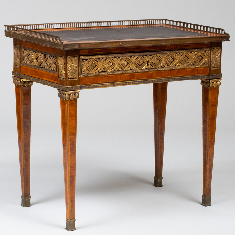 Appraisal: UNUSUAL LOUIS XVI ORMOLU-MOUNTED TULIPWOOD AND WALNUT PARQUETRY TABLE CRIRE