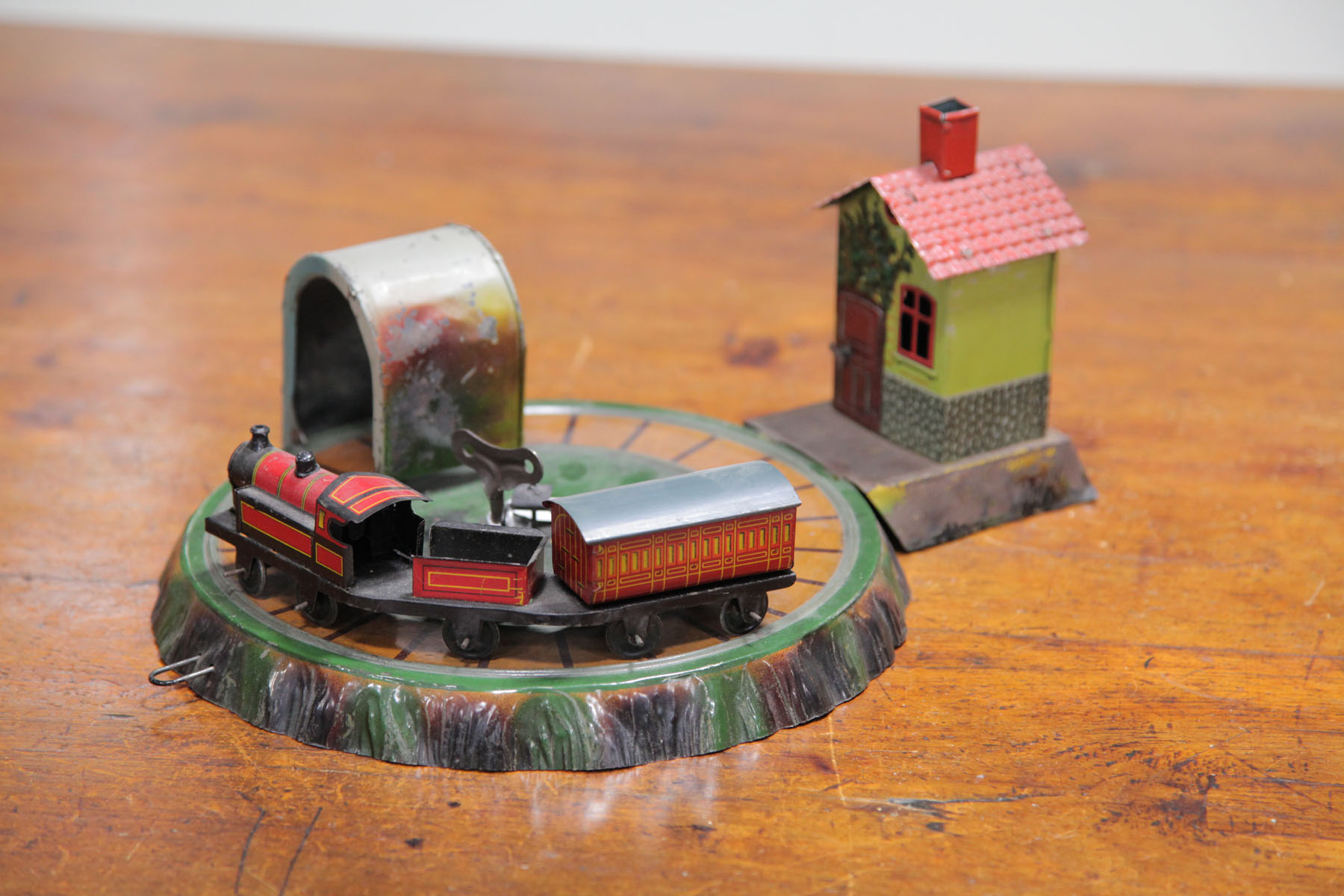 Appraisal: TRAIN AND STATION WIND-UP German th century Tin lithographed train