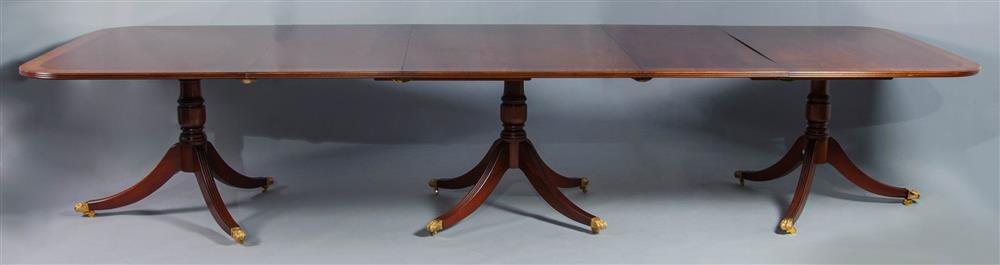 Appraisal: REGENCY STYLE THREE PEDESTAL BANDED MAHOGANY DINING TABLE WITH STRING