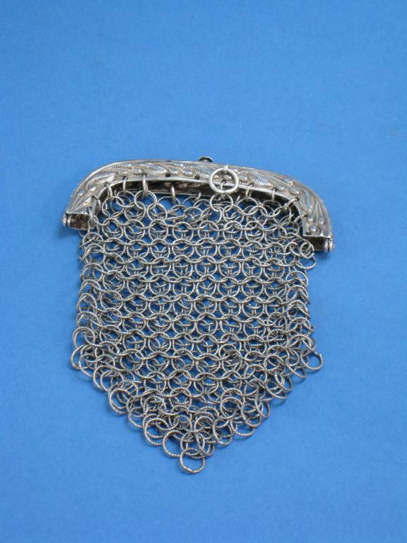 Appraisal: A Georgian small mesh Purse with leafage engraved mount Birmingham