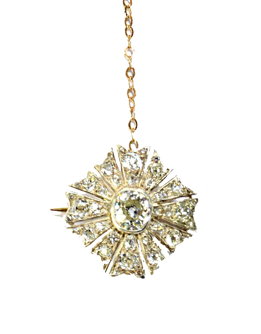 Appraisal: A diamond set brooch collet set with the principal cushion