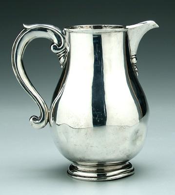 Appraisal: English silver water pitcher pear form circular base S-scroll handle