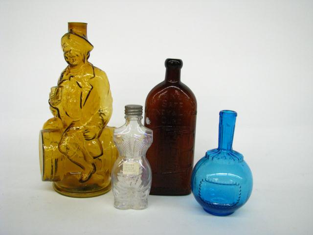 Appraisal: Group of four antique bottles including cobalt globe Man on