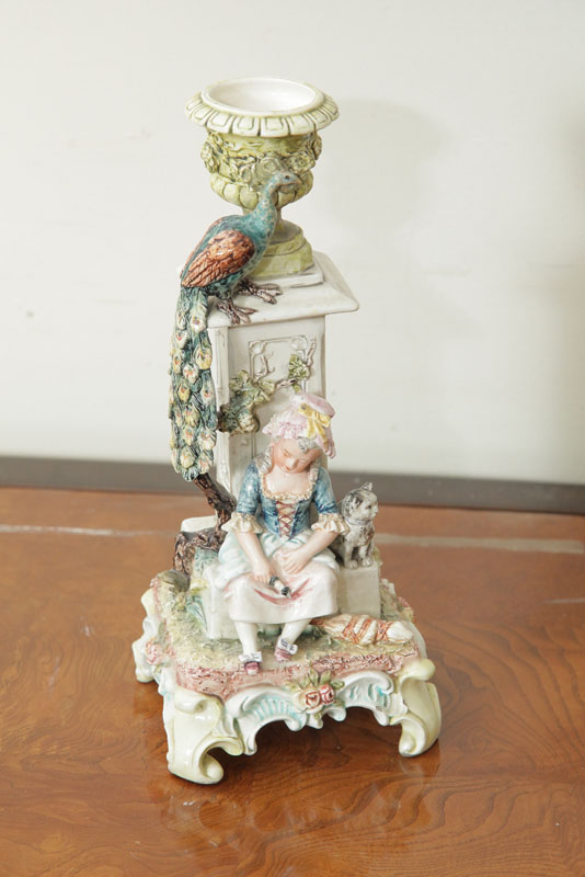 Appraisal: MAJOLICA-TYPE GERMAN CANDLESTICK Profusely decorated with a column surmounted by