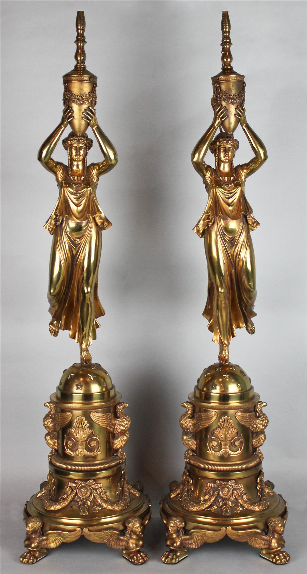 Appraisal: A PAIR OF EMPIRE STYLE GILT BRONZE FIGURAL LAMPS each