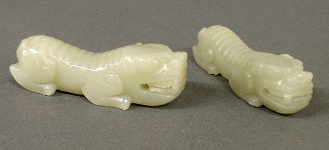 Appraisal: - Pair of Chinese green jade recumbent mourning dragons l