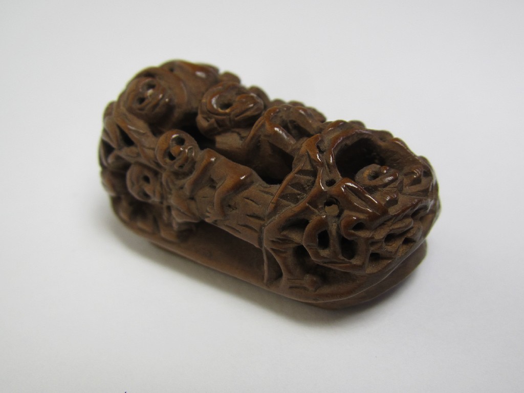 Appraisal: A boxwood carved netsuke decorated with a group of monkeys