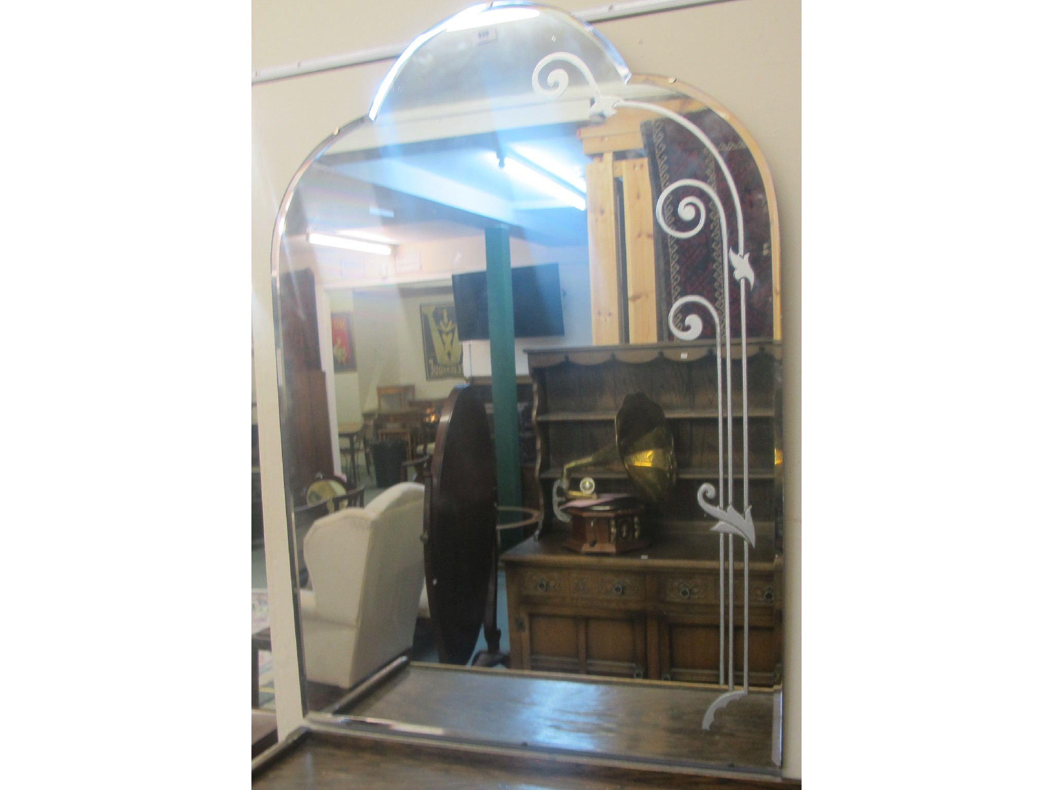 Appraisal: An arch shaped wall mirror