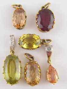 Appraisal: Six gem set pendants including three topaz and one chrysoberyl