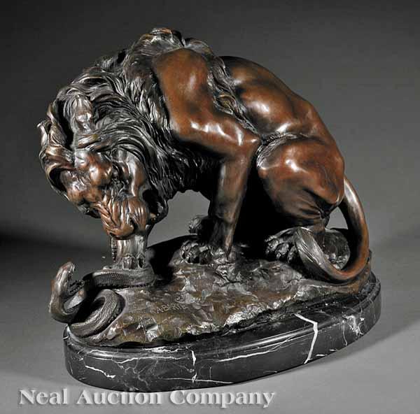 Appraisal: A Continental Bronze of A Lion Toying with a Serpent