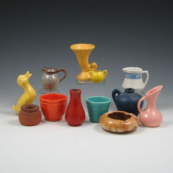 Appraisal: Eleven cabinet pieces of pottery including vase jugs etc Most