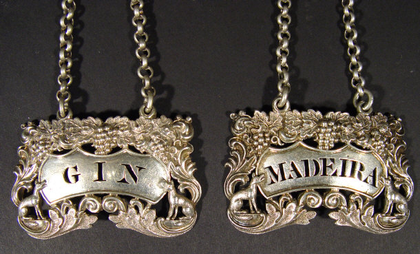 Appraisal: Pair of Georgian silver decanter labels with pierced lettering 'Gin'