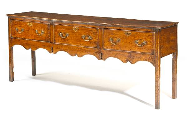 Appraisal: A George III elm dresser base fourth quarter th century