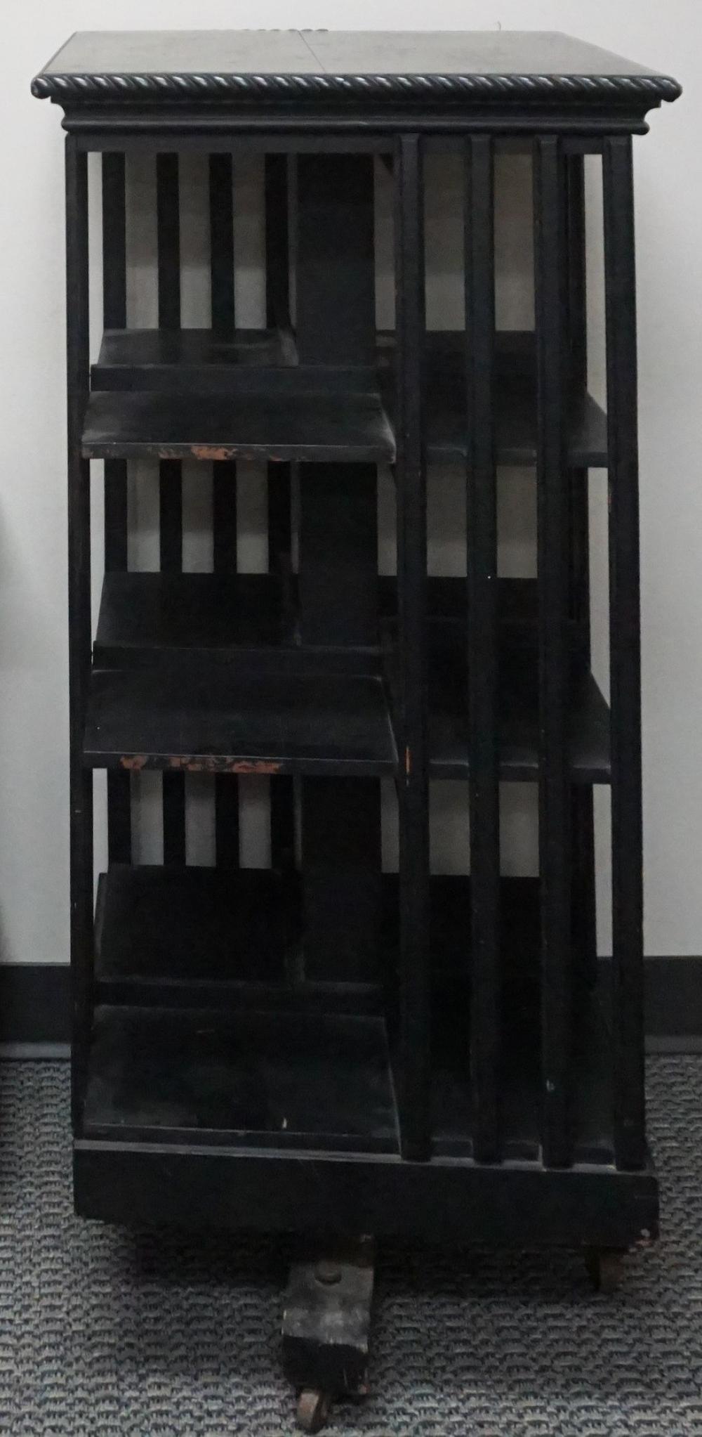 Appraisal: EBONIZED WOOD REVOLVING BOOKCASE X X IN X X CM