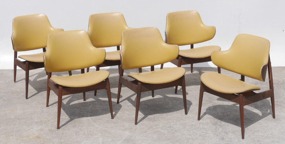 Appraisal: KODAWOOD CLAM SHELL MID CENTURY ARM CHAIRS Yellow leather upholstered