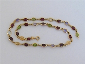 Appraisal: An Italian carat gold and multigem necklace set along its