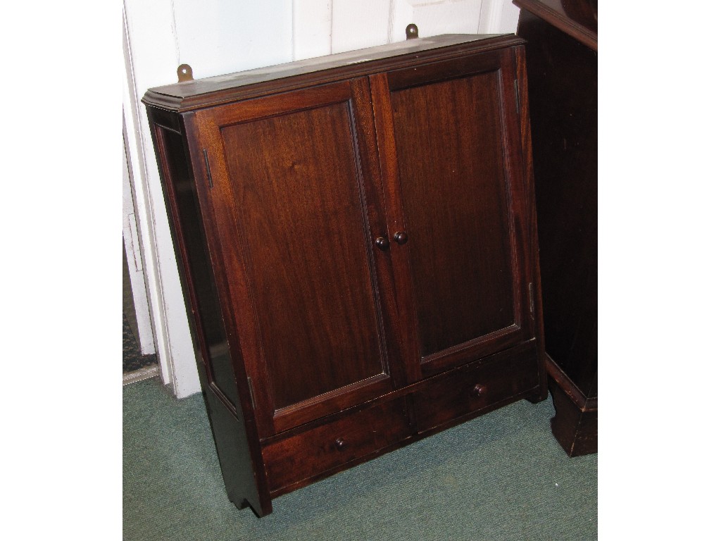 Appraisal: Mahogany wall mounted two door cupboard