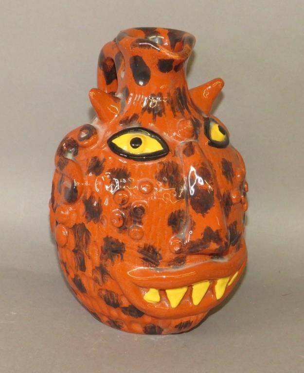 Appraisal: FOLK ART REDWARE FACE JUG BY JAMES C SEAGRAVES Bca