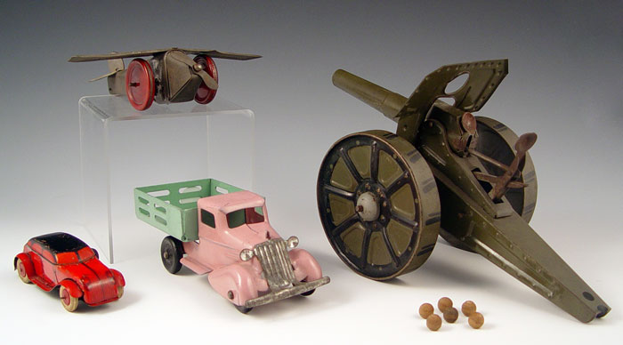 Appraisal: PIECE TIN TOY LOT CANNON AIRPLANE CARS pieces to include