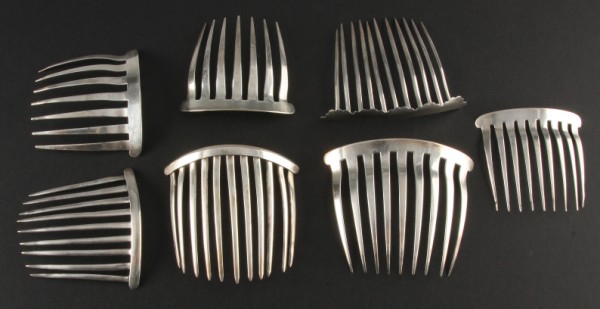 Appraisal: Seven silver hair combs one marked N Le Huray one