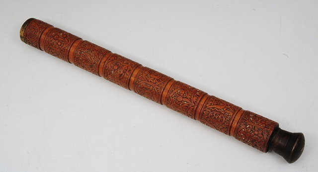 Appraisal: A TIBETAN CYLINDRICAL METAL AND HARDWOOD CONTAINER carved with eight